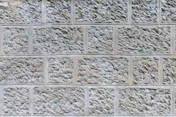 Plaster imitating natural stone. Rough textured wall surface. Background or backdrop. Blank for design