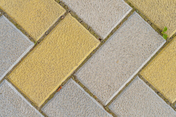 Fototapeta premium Rough textured paving slab surface, top view. Background or backdrop. Design blank
