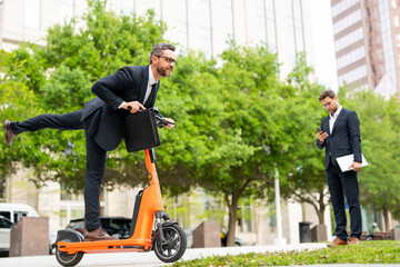 Businessman's electric scooter sparks curiosity and conversation. Businessman on scooter represents...