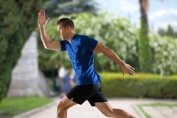 Fototapeta premium Cheerful and successful man jogging outdoor