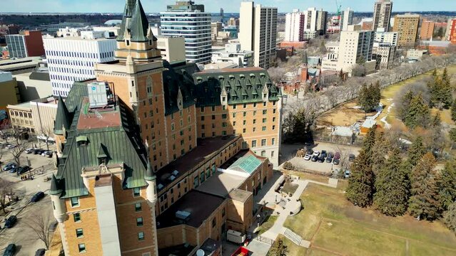 Aerial view of the downtown area of Saskatoon, Saskatchewan, Canada. Reveal of Marriott Bessborough Hotel in the middle of Downtown Saskatoon, Saskatchewan, Canada