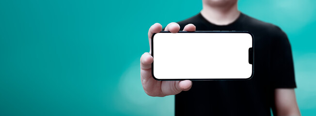 cell phone in hand held horizontally with blue background - transparent screen png