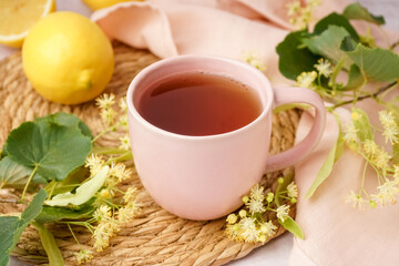 Cup of linden tea and lemon, closeup