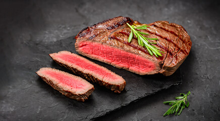 delicious roast beef on a wooden banner and spices