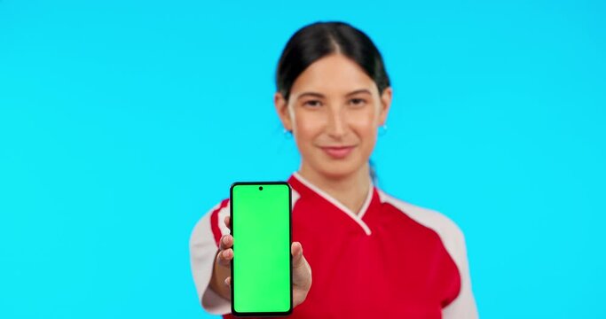 Phone, woman and green screen, chroma key or marketing with athlete for sports mobile, app and mockup. Face, smartphone and portrait of person in sport, advertising and display on blue background