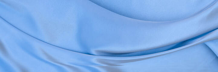 Sky blue satin texture that is gray silver fabric silk background with beautiful soft white pattern...