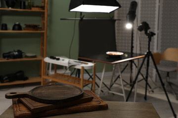 Professional equipment and composition with tasty dish on table in photo studio, selective focus. Food photography