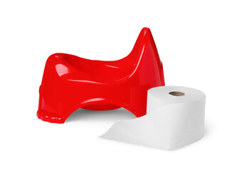 Red baby potty and toilet paper on white background