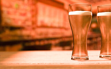 Two mugs of ice cold beer on a defocused bar background. Brewery and gastronomy. 3d render.