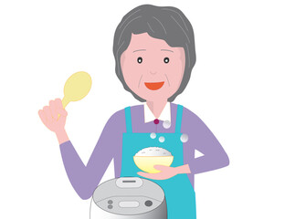 高齢者の女性が食卓の準備をしている。