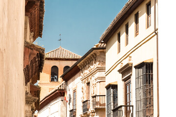 Granada,Spain. April 14, 2022: Architecture of the center of Granada on a summer day and blue sky.