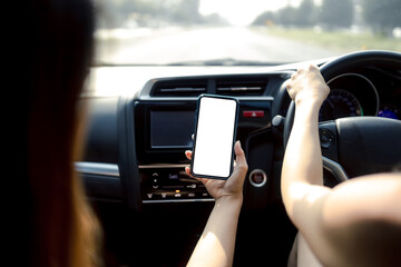 Woman holding a smartphone with white blank screen, Woman to use navigation applications in driving, copy space