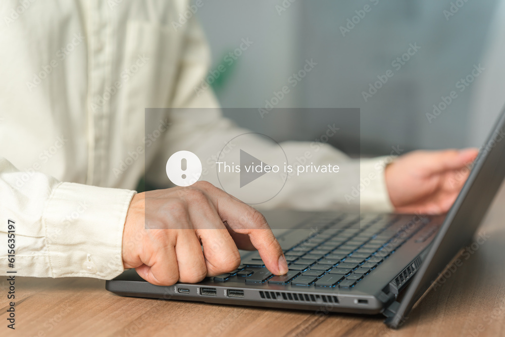 Poster Young man using a laptop computer to play social media but this video is blocked or privacy settings have been set. Searching for more internet, search engine optimization.