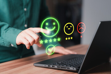 Shopper hand touching the virtual screen on the happy smile face icon for assessment feedback...