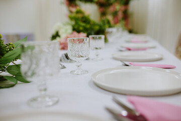 Beautiful wedding table decoration with flowers. Selective focus and toned image.