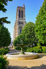 Fountain in the gardens of Mantoue Square outside the medieval basilica-cathedral of Soissons,...