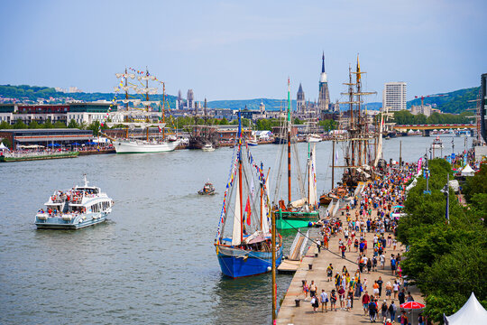 Rouen, France - June 17, 2023: Old sailing ships moored on the quays of the Seine in Rouen in Normandy for the Armada, a popular international gathering of historic schooners