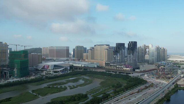 Ascending aerial view of Macau Cotai casino hotel area