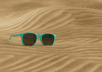 Sunglasses on Wavy Sand 3D rendered