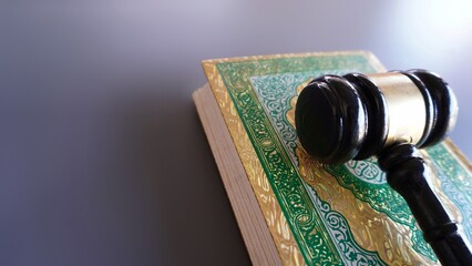 Gavel and Quran with copy space. Sharia or Islamic law concept