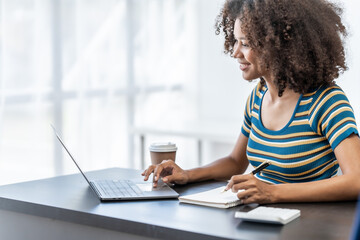 Young female african american student learning chinese language class online lecture via video conference, distance education