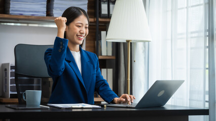 Young chinese business woman doing bookkeeping analyst audit working papers, public offering, cash...