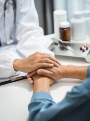 Mature chinese woman in consultation with a doctor with abdominal pain. depression.