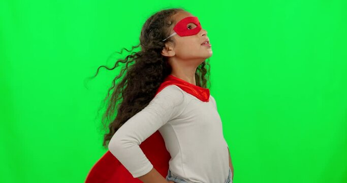 Girl child, hero and green screen with mask, strong and justice with hands on hips for mockup. Young female kid, power and portrait with confidence, superhero cape and stop crime in studio background