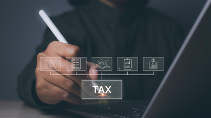 Businessman using computer to complete Individual income tax return form online for tax payment.