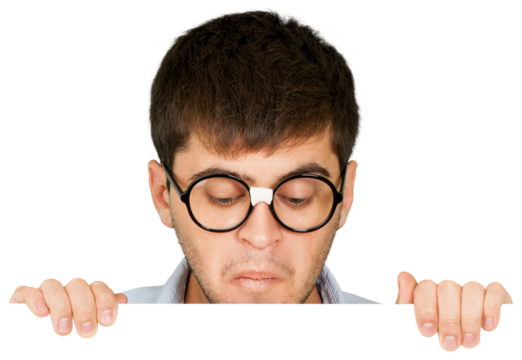 Man in taped up glasses looking down at a blank sign or board - Powered by Adobe