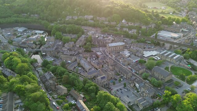 Short slow moving drone shot of todmorden town center as the sun was setting on a calm mid week evening 