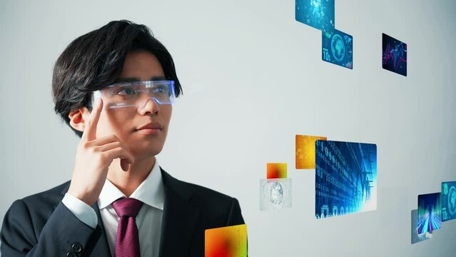 A man watching at a holographic image with VR goggles.