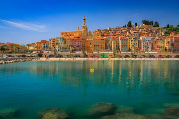 View of the colorful old town facades above the Mediterranean Sea in Menton on the French Riviera,...