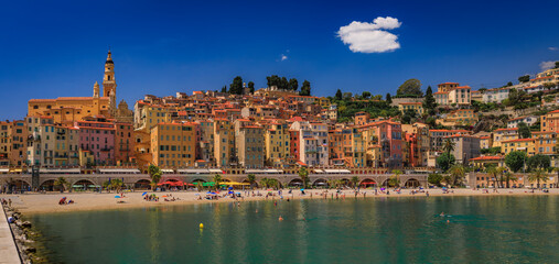 View of the colorful old town facades above the Mediterranean Sea in Menton on the French Riviera,...