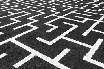 White maze on the floor. Аsphalt with white straigt lines. Labyrinth on a pavement. Playground...