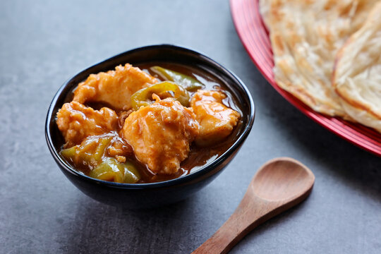 Kerala parathas / porotta / roti / parotta / barotta/ naan layered flatbread made from maida or whole wheat flour. Eat with spicy Asian chicken or beef or egg curry gravy. breakfast dish. Indian food.