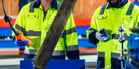 Fototapeta premium Professional team labor machanic engineer technician worker industrial work control with machine, manufacturing, factory, production line, Indusry 4.0, robot, industrial facility.business planning