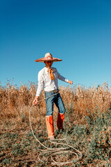 A cowboy in the expansive prairie, wielding his lariat amidst a bountiful harvest