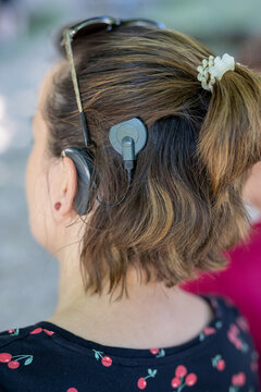 Woman head with cochleral implant hearing aid