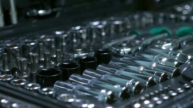 sockets from a set of car tools. toolbox in auto shop. High quality 4k footage. Close-up auto parts. set of car tools in a suitcase close up
