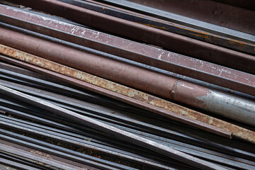 Rusty iron bars stacked together