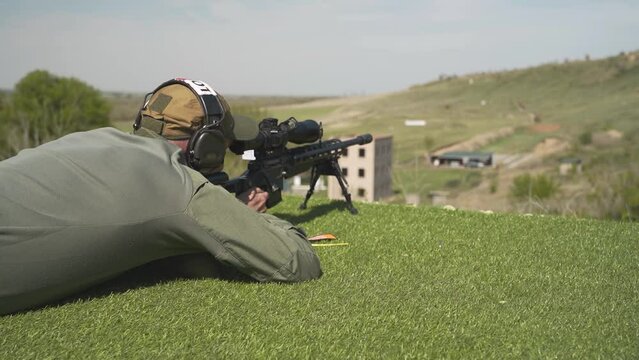 the shooter performs the exercise point-by-point, shooting rifle at the target