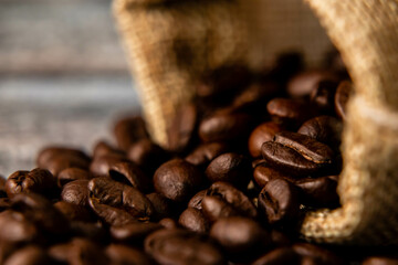 Extreme close up shot of coffee beans with defocused background.