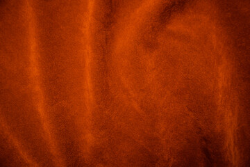 Orange velvet fabric texture used as background. orange fabric background of soft and smooth textile material. There is space for text.