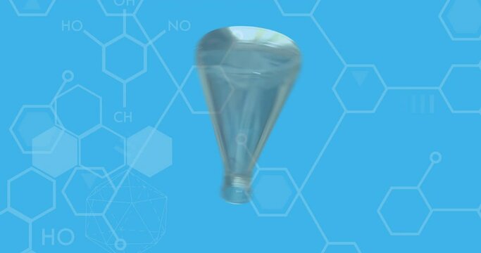 Turning test flask and dna strand diagrams over blue background