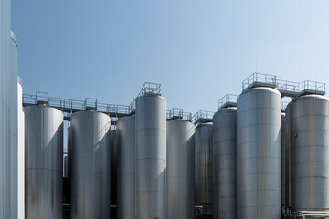 Agricultural silos for storage of grain harvest at an agricultural production farm