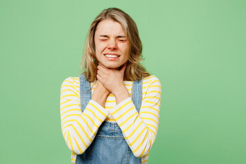 Sick unhealthy ill allergic sad woman has red watery eyes runny stuffy sore nose suffer from allergy trigger symptoms hay fever anaphylactic shock hold neck isolated on plain green background studio.