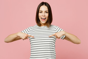 Young smiling happy fun cheerful caucasian woman she wearing casual clothes t-shirt pointing index fingers on herself isolated on plain pastel light pink background studio portrait. Lifestyle concept.