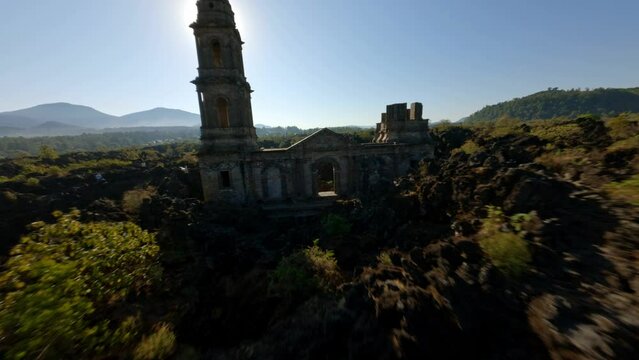 FPV DRONE SHOT OF PARICUTIN VOLCANO TEMPLE RUINS IN MICHOACAN 