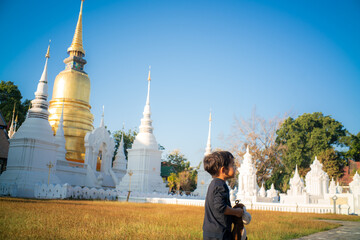 2 Year asian boy enjoying travel in buddhist temple